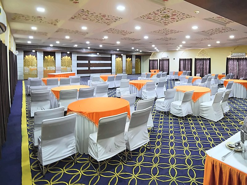 Conference hall with round tables at Hotel Gold Palace & Resorts, Jaipur